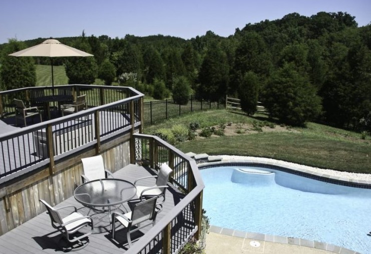 Two level deck overlooking a pool
