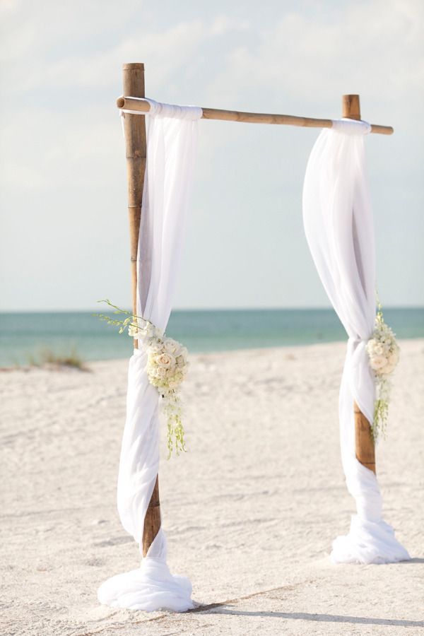 Simple bamboo white wedding arch